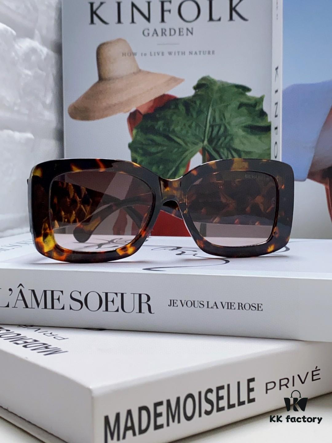 CHANEL New Classic Black and White Sunglasses with Logo-Embellished Temples