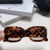 CHANEL New Classic Black and White Sunglasses with Logo-Embellished Temples