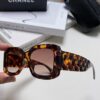 CHANEL New Classic Black and White Sunglasses with Logo-Embellished Temples