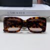 CHANEL New Classic Black and White Sunglasses with Logo-Embellished Temples