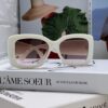 6931f82b3a89a121ed5497a1 CHANEL New Classic Black and White Sunglasses with Logo-Embellished Temples