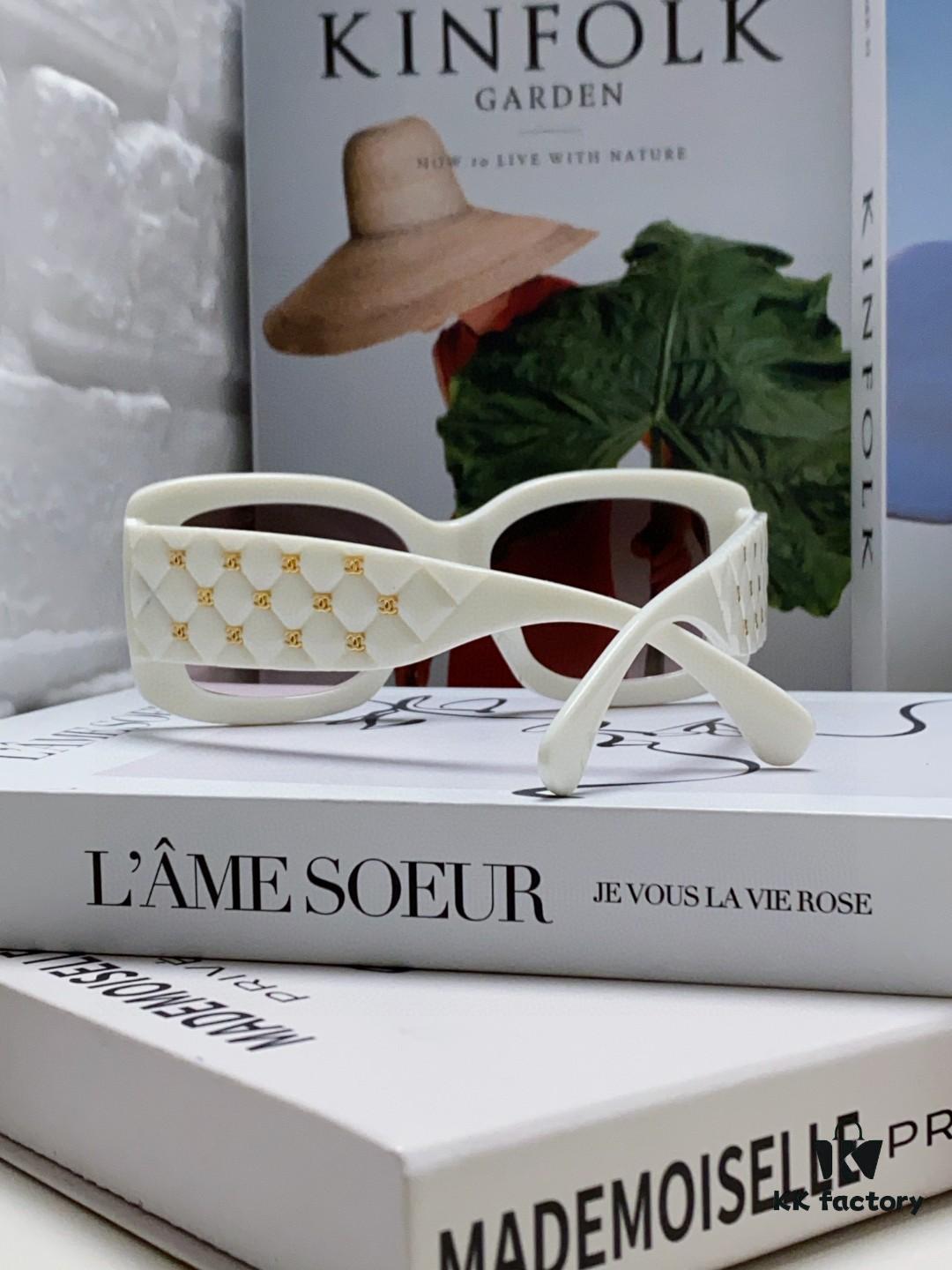 6931f82b3a89a121ed5497a2 CHANEL New Classic Black and White Sunglasses with Logo-Embellished Temples