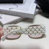 6931f82b3a89a121ed5497a4 CHANEL New Classic Black and White Sunglasses with Logo-Embellished Temples