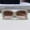 6931f82b3a89a121ed5497a6 CHANEL New Classic Black and White Sunglasses with Logo-Embellished Temples