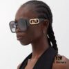 6931fca63a89a121ed54d163 FENDI Acetate O'Lock Sunglasses with Gold-Tone Metal Temples Featuring Oversized O'Lock Logo