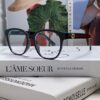 6931fe573a89a121ed54e77f Gucci 2025 New Arrival Women's Woven Art Close-up Frame Black Fashion Sunglasses with Classic Red and Green Band