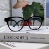 6931fe573a89a121ed54e780 Gucci 2025 New Arrival Women's Woven Art Close-up Frame Black Fashion Sunglasses with Classic Red and Green Band