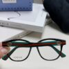 6931fe573a89a121ed54e783 Gucci 2025 New Arrival Women's Woven Art Close-up Frame Black Fashion Sunglasses with Classic Red and Green Band