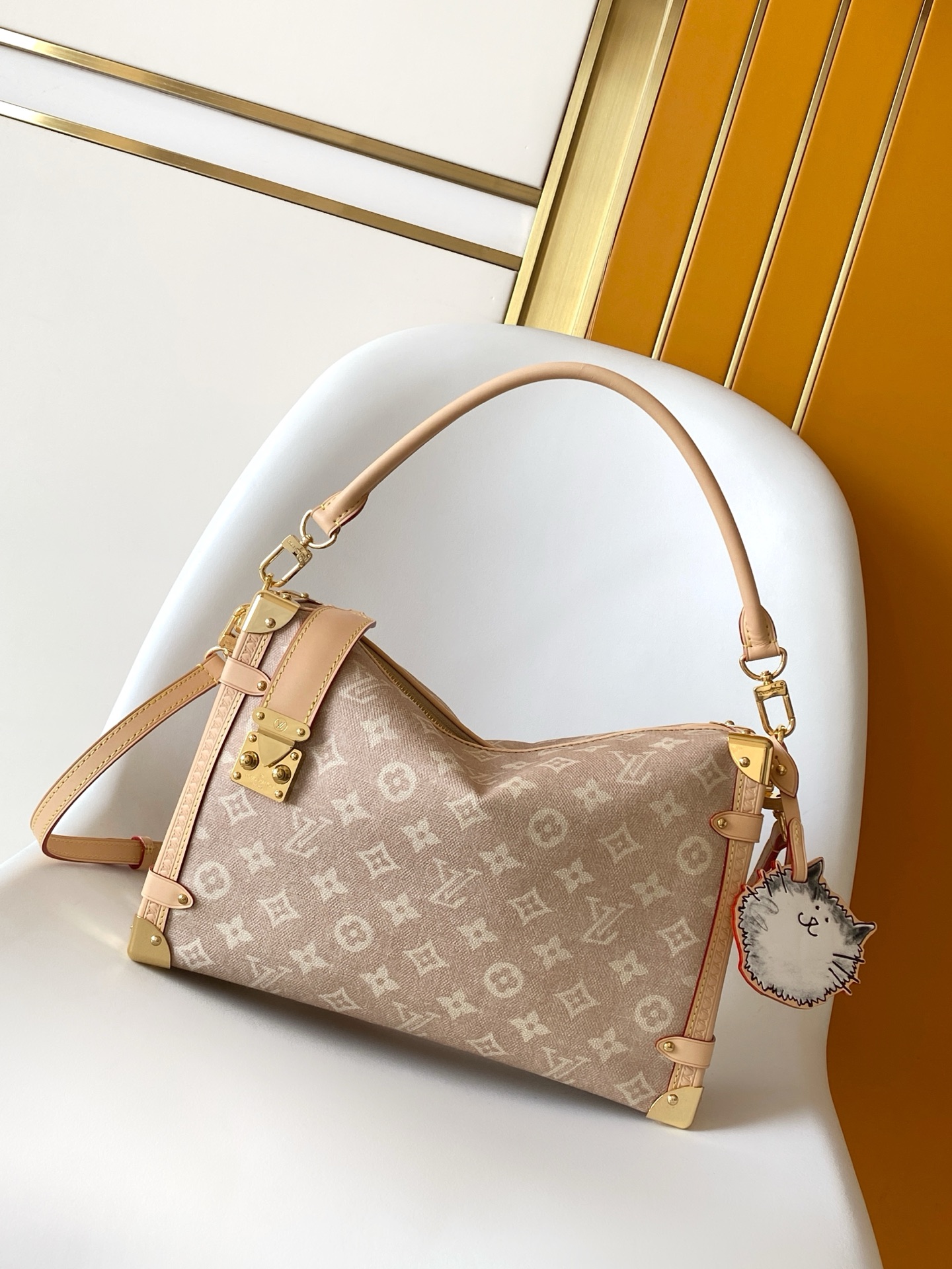 Louis Vuitton This "LV Travels With" edition of the large Side Trunk handbag showcases the brand's collaboration with a fashion icon and artist.