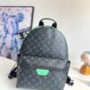 Louis Vuitton This small Discovery backpack features a patchwork of Monogram Eclipse canvas and vibrant cowhide leather.