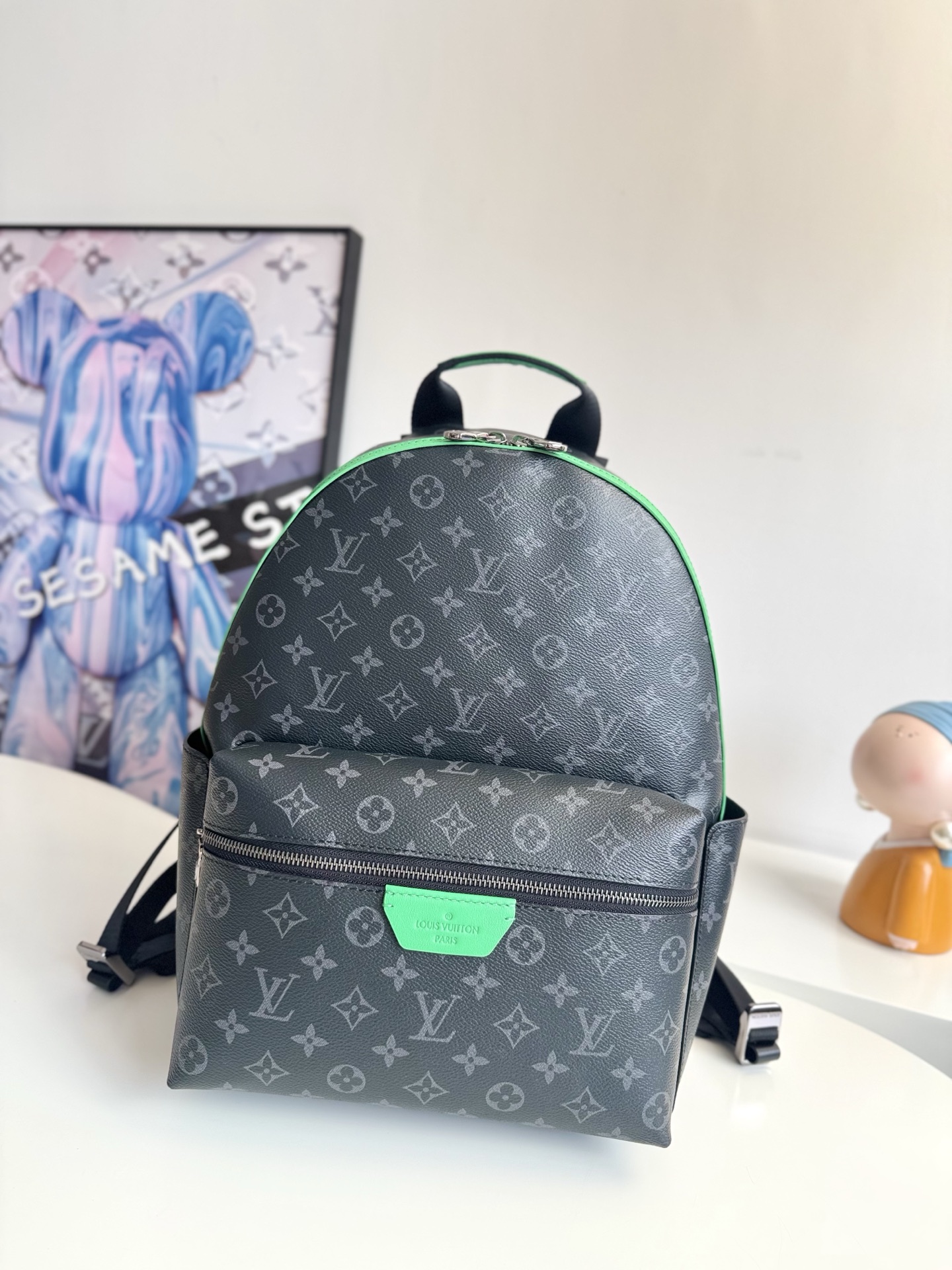 Louis Vuitton This small Discovery backpack features a patchwork of Monogram Eclipse canvas and vibrant cowhide leather.
