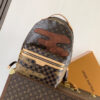 Louis Vuitton This Discovery Small Backpack features Monogram canvas accented with Monogram Reverse and Damier canvas patches.