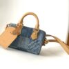 Louis Vuitton N40682 — FW New Denim Collection. The Sunset bag takes center stage in Monogram Denim canvas.