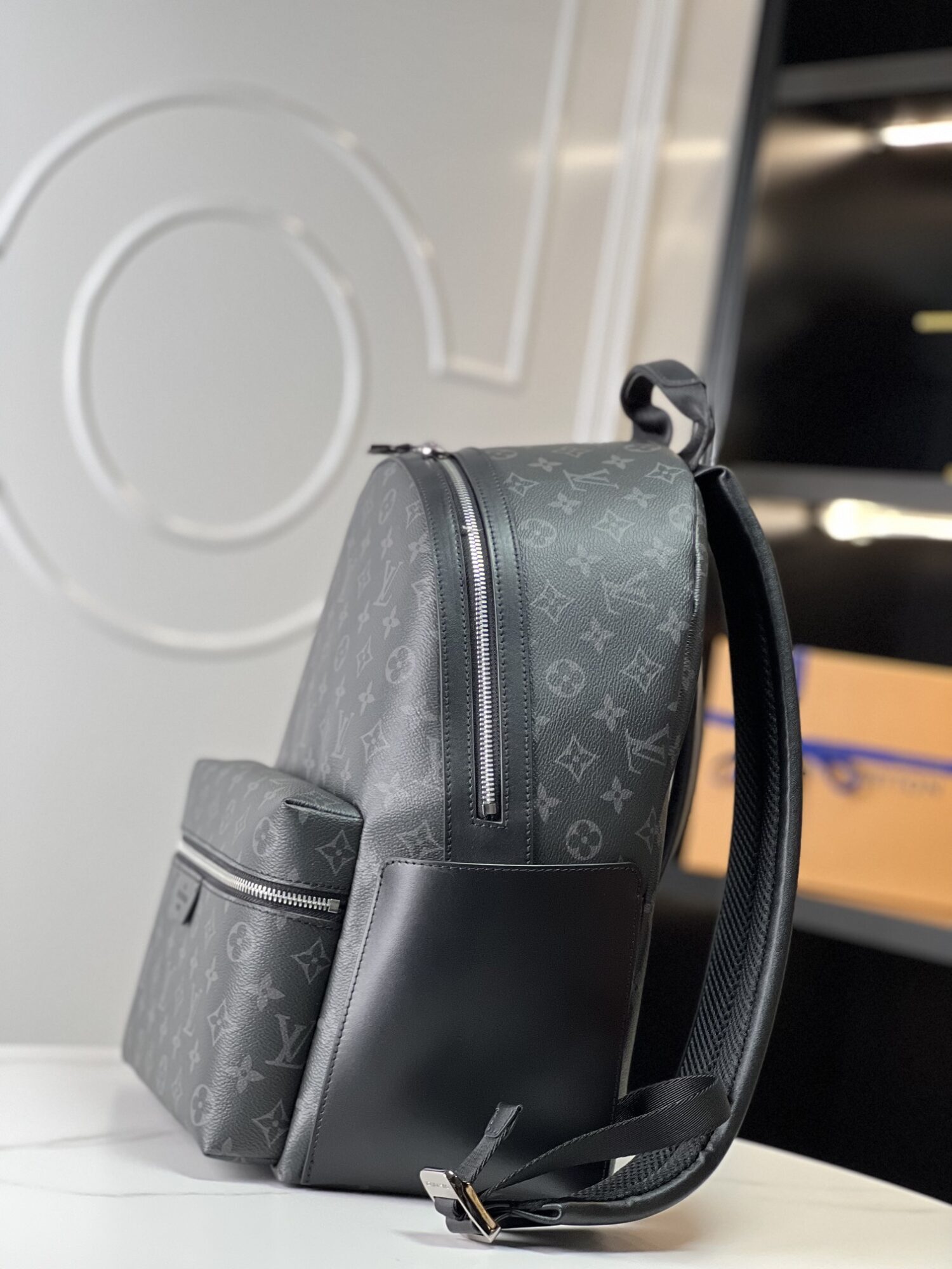 1 Crafted from Monogram Eclipse canvas, this small Discovery backpack retains its versatile functionality in a more compact silhouette.