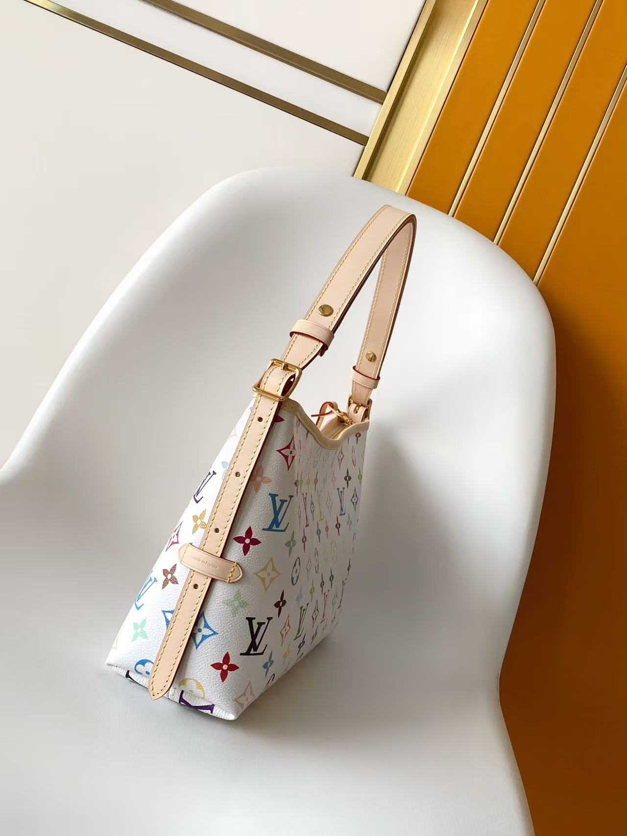 1 Louis Vuitton This Carryall East-West canvas handbag illuminates this classic element with a vibrant splash of color.