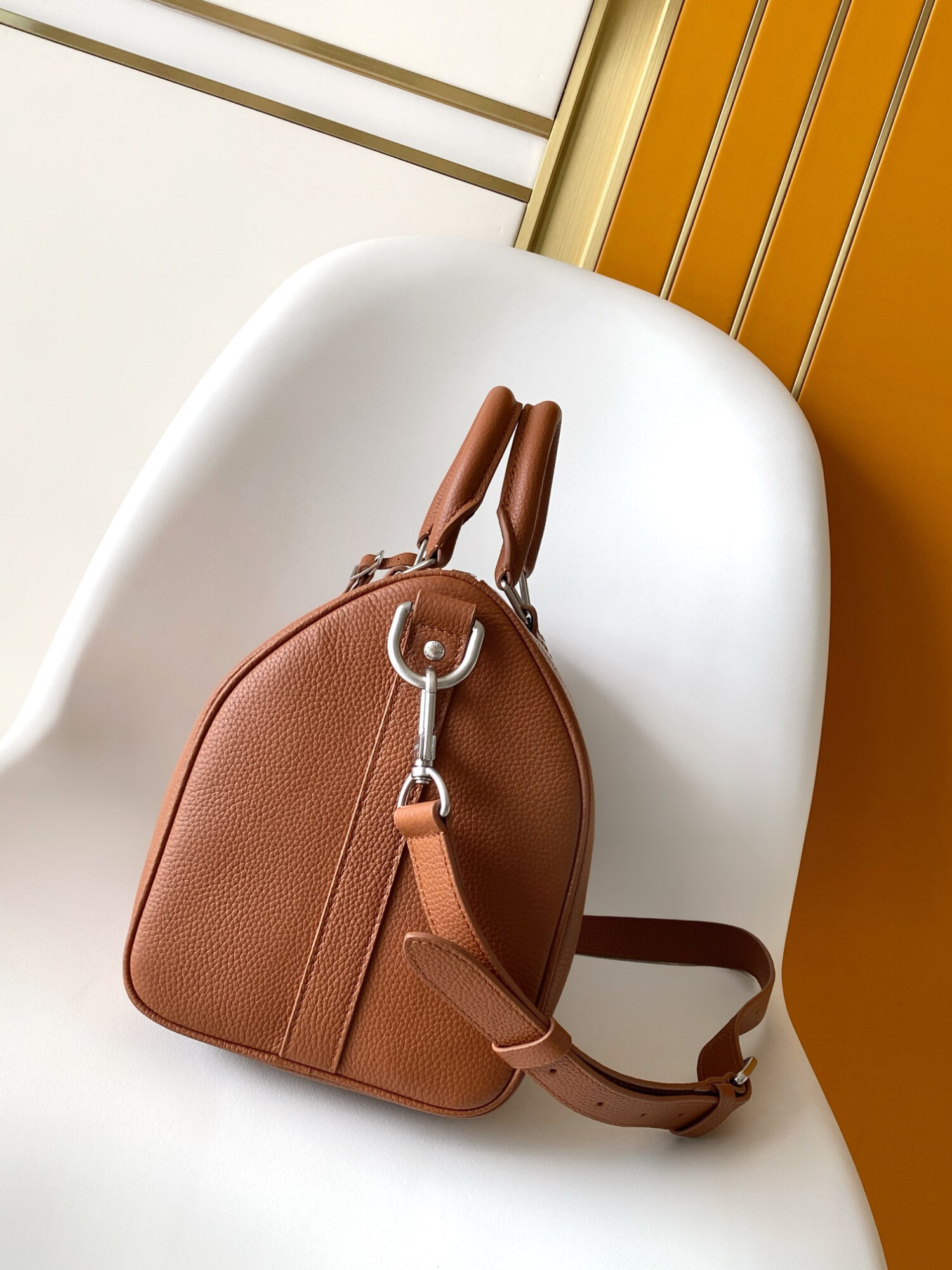 1 Louis Vuitton Keepall Bandoulière 35 Bag — This practical and versatile Keepall Bandoulière