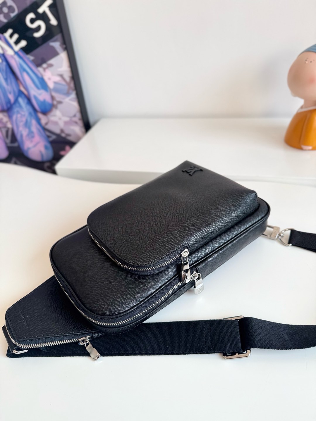 1 Louis Vuitton This Avenue shoulder bag is crafted from Taïga cowhide leather.