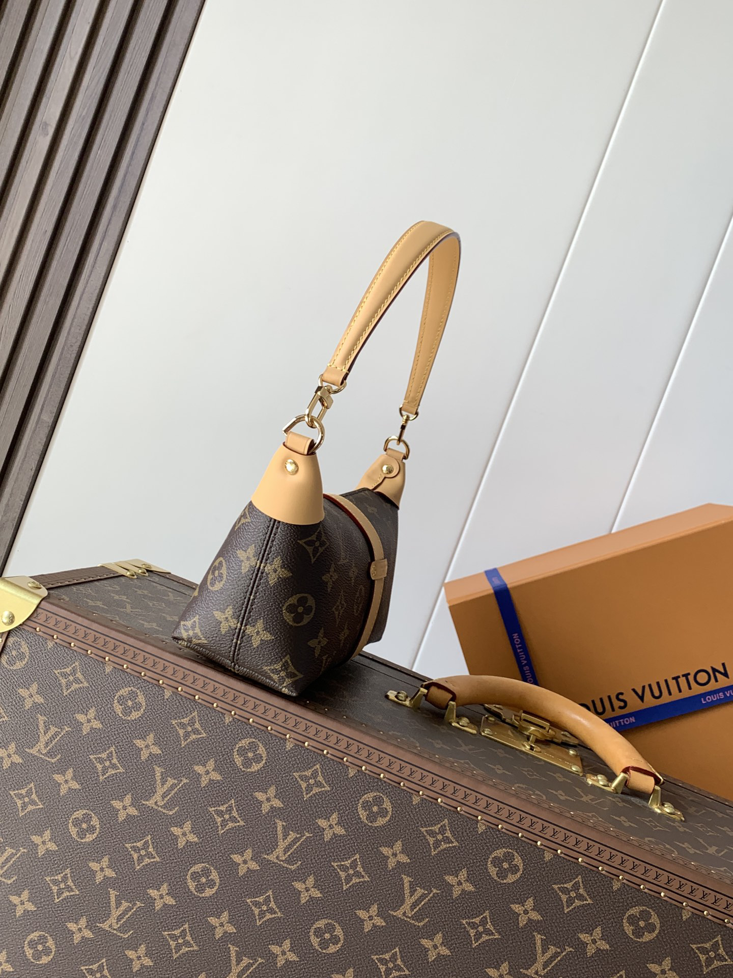 1 Louis Vuitton This Pochette Mia handbag, part of the Monogram collection, features a Monogram canvas body accented with cowhide leather trim.
