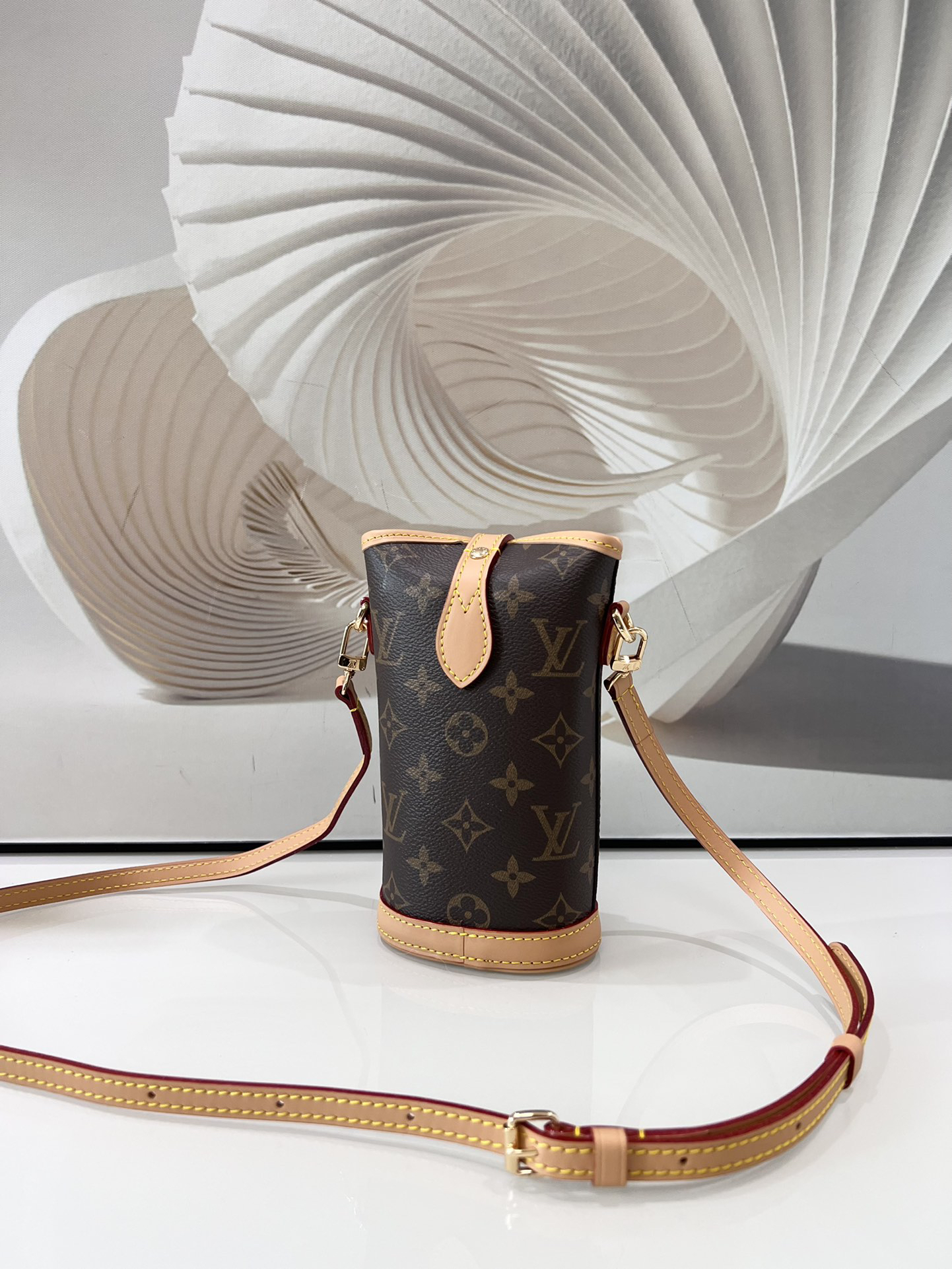 1 Louis Vuitton Mini Ice Cream Cone Bag — New "Fold Me" Mini Model, featuring a magnetic button closure design.