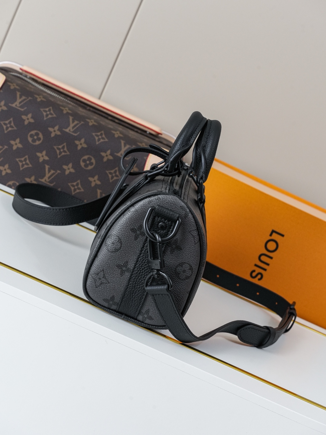 1 Louis Vuitton This Keell Bandoulière 25 handbag features Monogram Midnight coated canvas accented with a deep Monogram print.