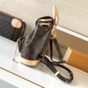 1 Louis Vuitton This Montsouris Mini features Monogram coated canvas with cowhide leather trim.