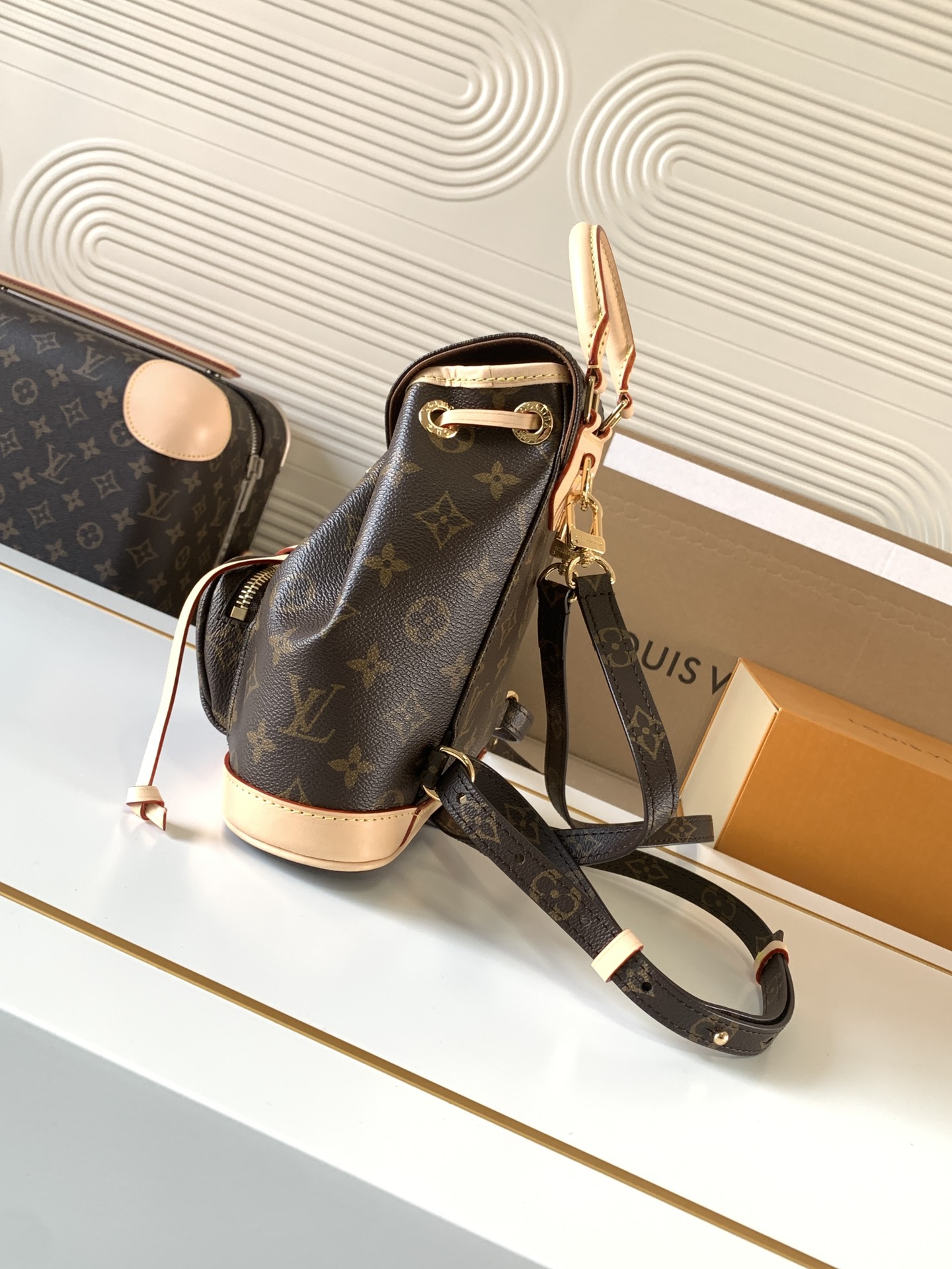 1 Louis Vuitton This Montsouris Mini features Monogram coated canvas with cowhide leather trim.