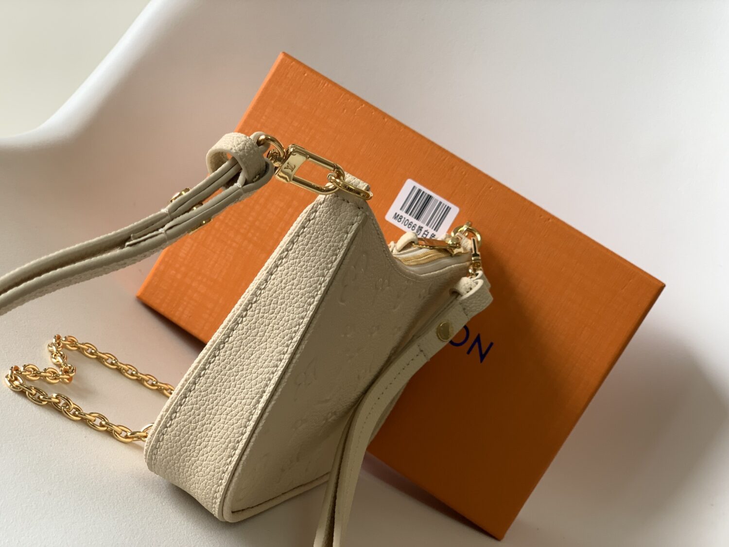 1 Louis Vuitton The Easy Pouch On Strap handbag from the Spring 2022 Collection is crafted from Monogram Empreinte leather.