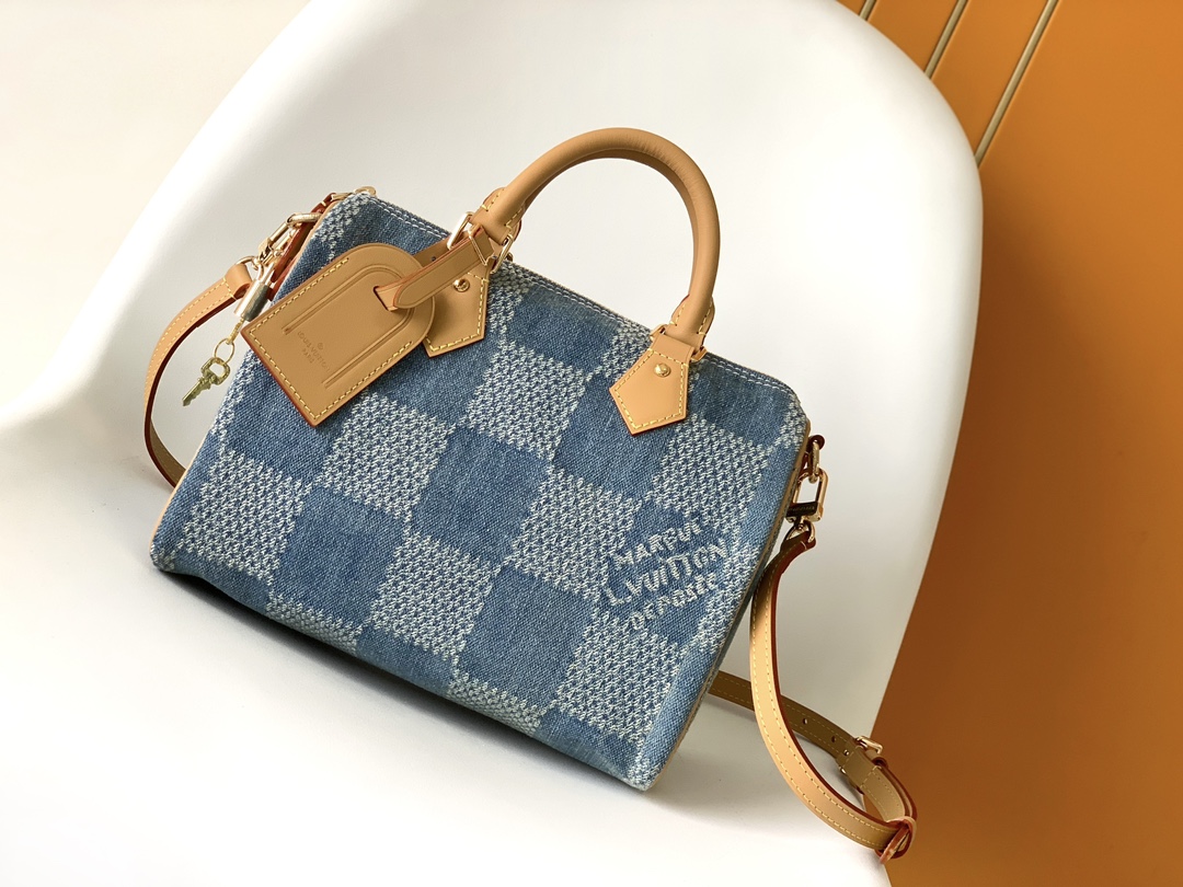 1 Louis Vuitton The new FW Denim Speedy 25 handbagâwhether worn crossbody...