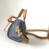 1 Louis Vuitton N40682 — FW New Denim Collection. The Sunset bag takes center stage in Monogram Denim canvas.
