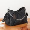 1 Louis Vuitton This small CarryAll Cargo handbag is crafted from soft lambskin, featuring a stylishly micro-crinkled finish.