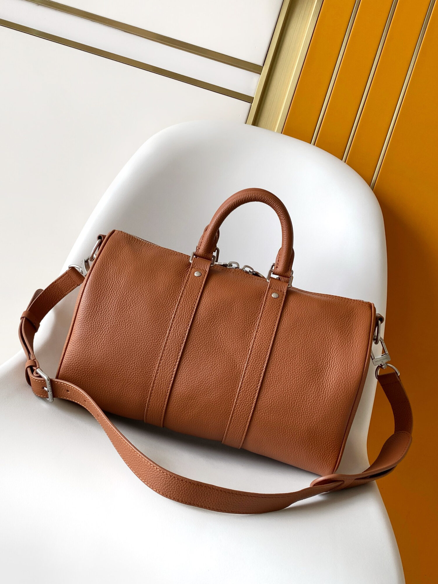 2 Louis Vuitton Keepall Bandoulière 35 Bag — This practical and versatile Keepall Bandoulière