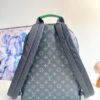 Louis Vuitton This small Discovery backpack features a patchwork of Monogram Eclipse canvas and vibrant cowhide leather.