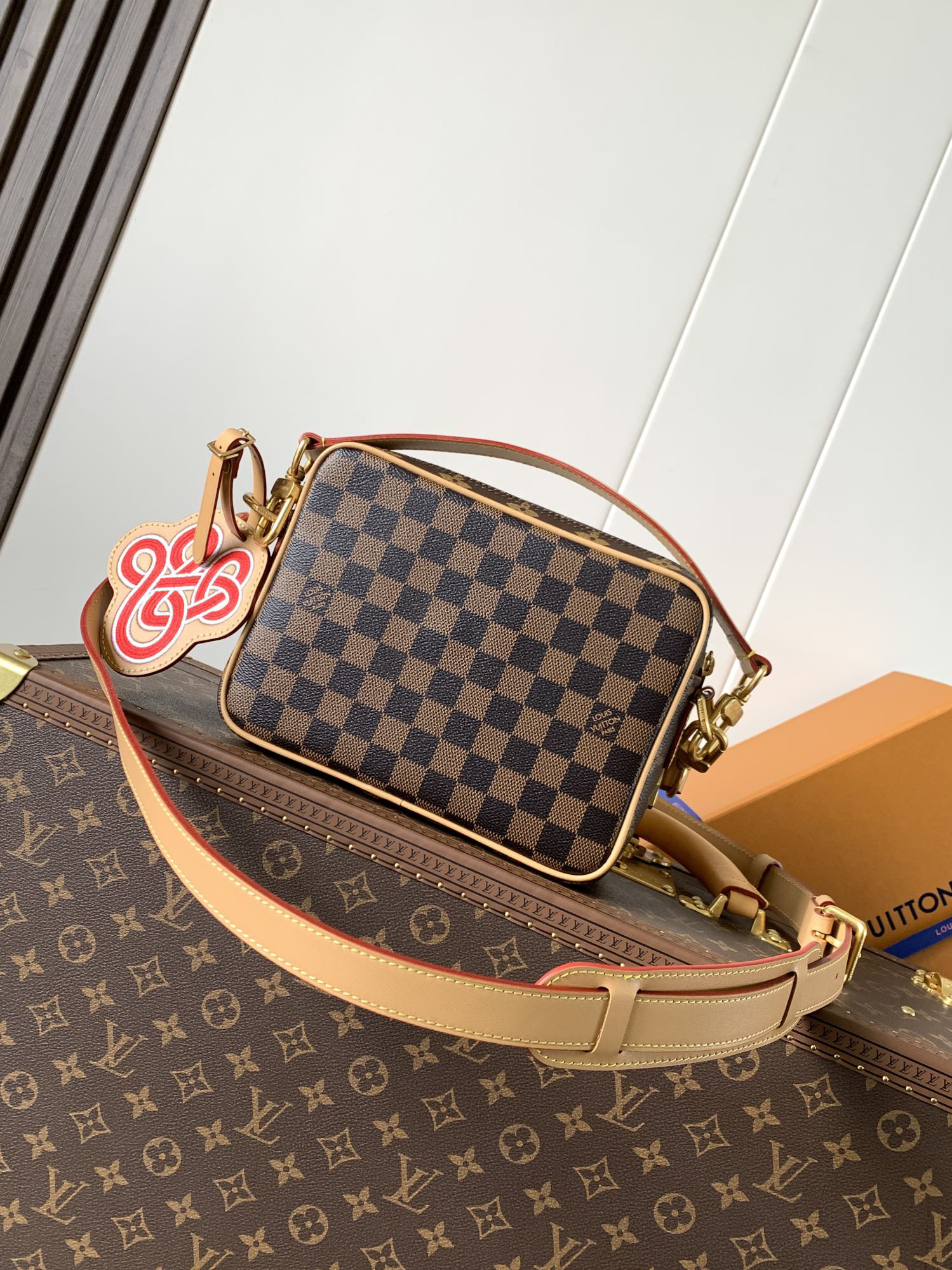 2 Louis Vuitton This Nil messenger bag features a Monogram canvas body accented with Damier and Monogram Reverse canvas patches, creating an elegant patchwork effect.