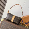 2 Louis Vuitton This Pochette Mia handbag, part of the Monogram collection, features a Monogram canvas body accented with cowhide leather trim.