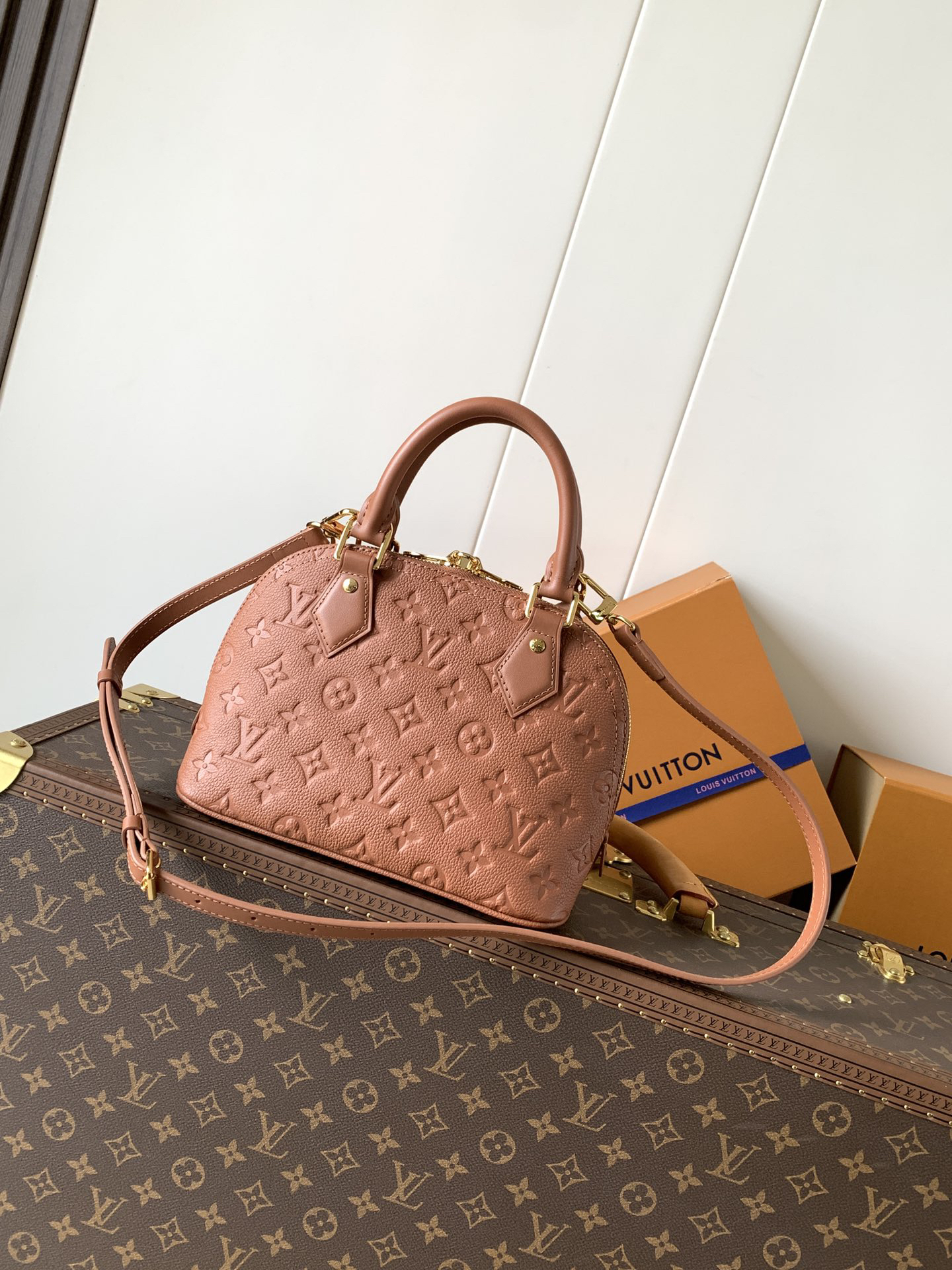 2 Louis Vuitton This Alma BB handbag showcases the iconic Alma BB silhouette, crafted from the House's exceptionally soft Monogram Empreinte leather.