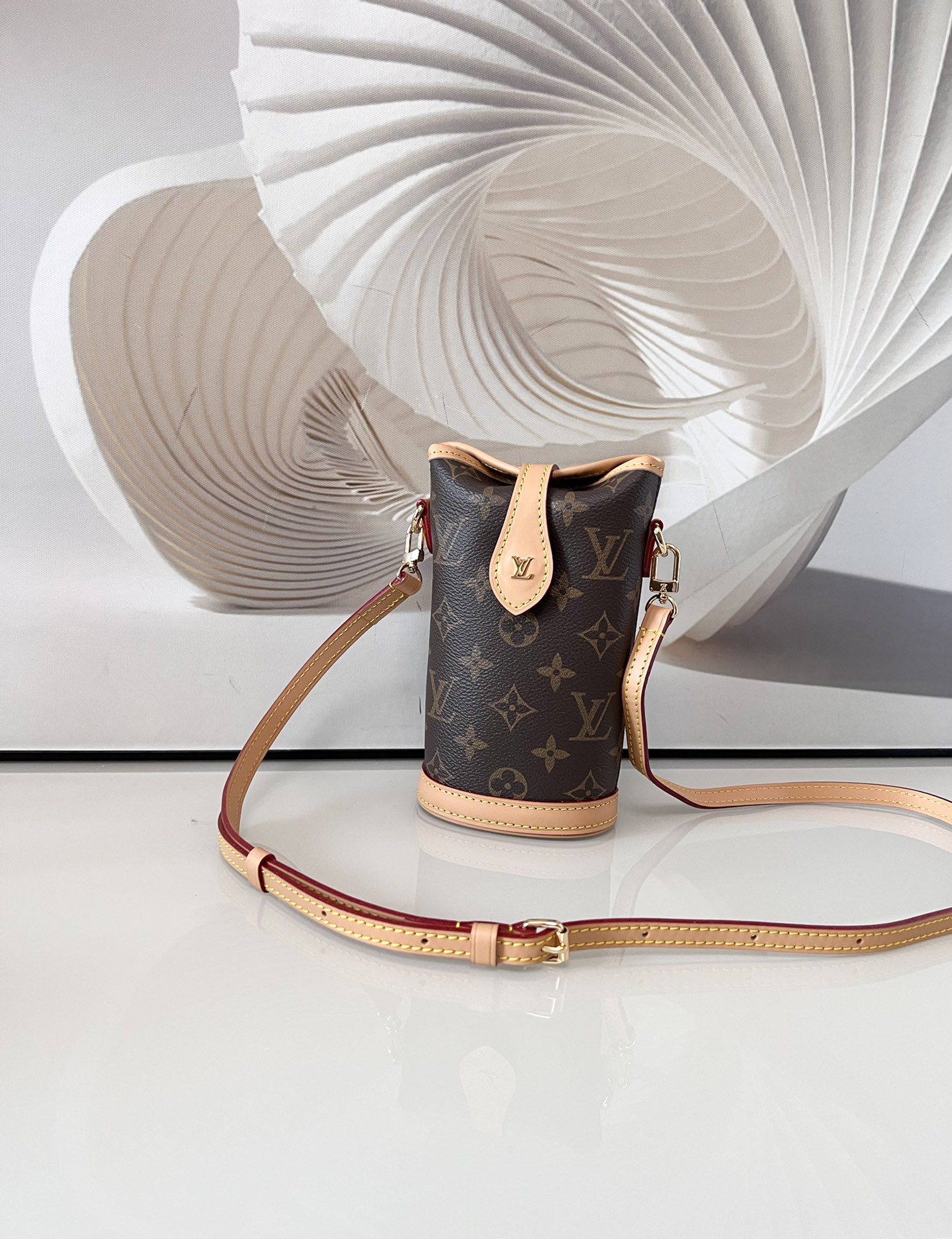 2 Louis Vuitton Mini Ice Cream Cone Bag — New "Fold Me" Mini Model, featuring a magnetic button closure design.