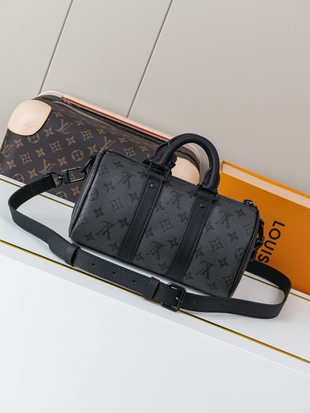 2 Louis Vuitton This Keell Bandoulière 25 handbag features Monogram Midnight coated canvas accented with a deep Monogram print.