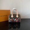 Louis Vuitton This Speedy Bandoulière 20 handbag combines Monogram canvas with cowhide leather trim.