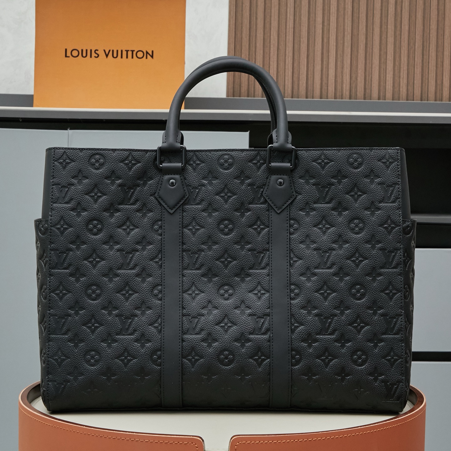 2 Louis Vuitton This Sac Plat 24H bag is crafted from Monogram-embossed Taurillon leather.