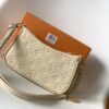 2 Louis Vuitton The Easy Pouch On Strap handbag from the Spring 2022 Collection is crafted from Monogram Empreinte leather.