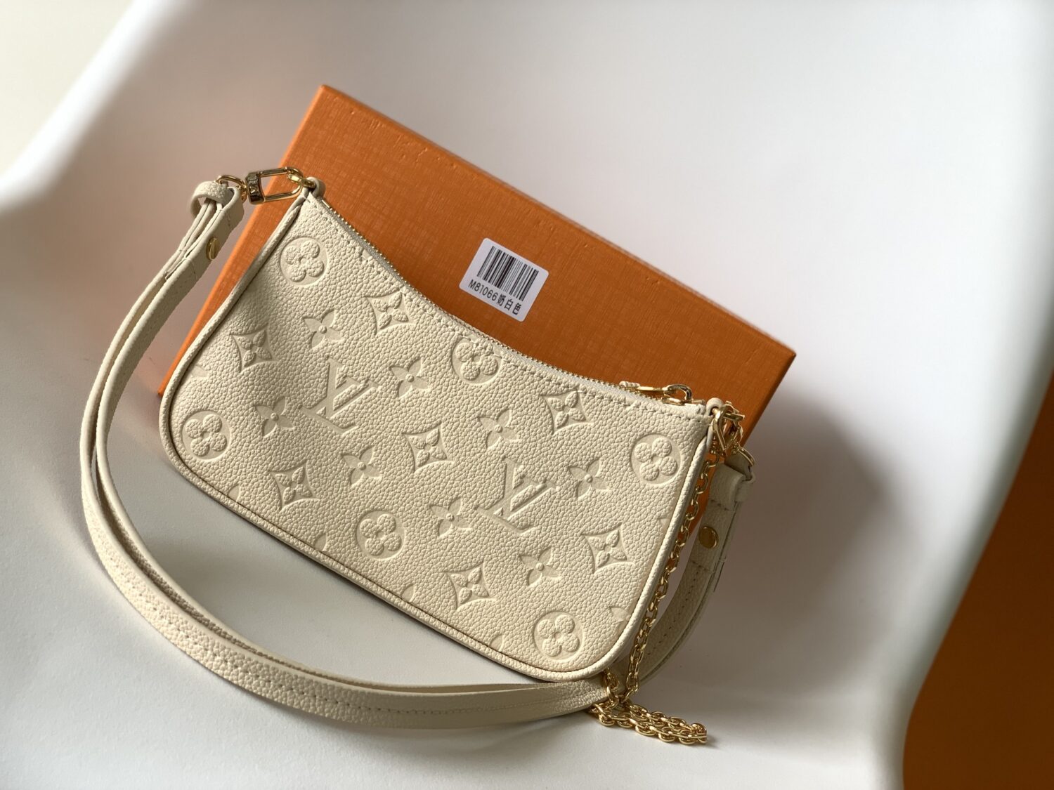 2 Louis Vuitton The Easy Pouch On Strap handbag from the Spring 2022 Collection is crafted from Monogram Empreinte leather.