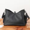 2 Louis Vuitton This small CarryAll Cargo handbag is crafted from soft lambskin, featuring a stylishly micro-crinkled finish.