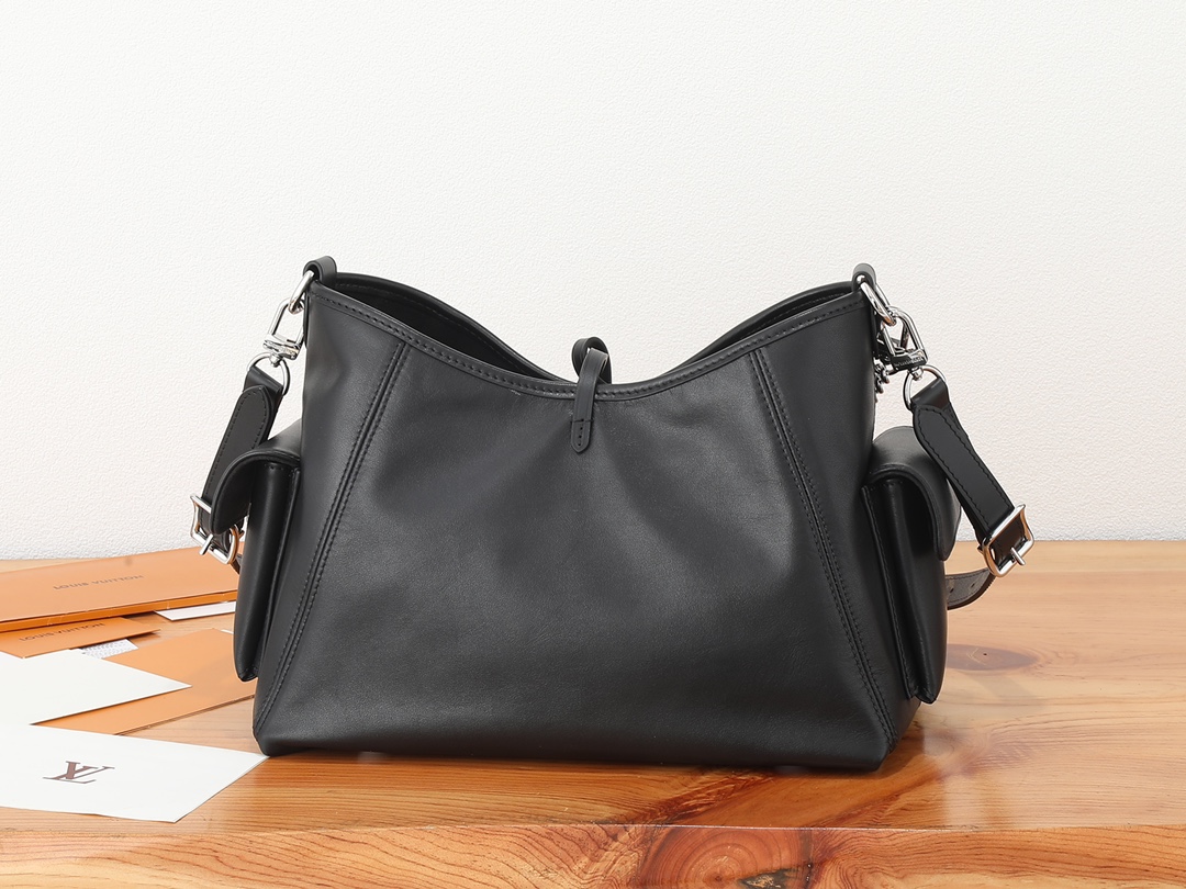 2 Louis Vuitton This small CarryAll Cargo handbag is crafted from soft lambskin, featuring a stylishly micro-crinkled finish.