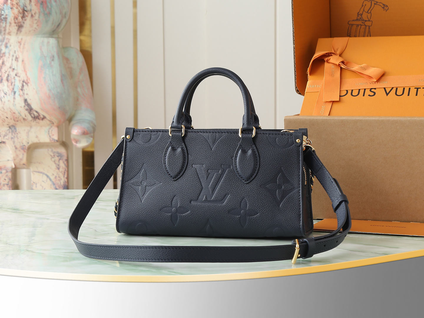 2 Louis Vuitton M23640 Deep Blue Embossed: This small OnTheGo handbag is crafted from Monogram Empreinte leather, embossed with the Giant Monogram pattern.