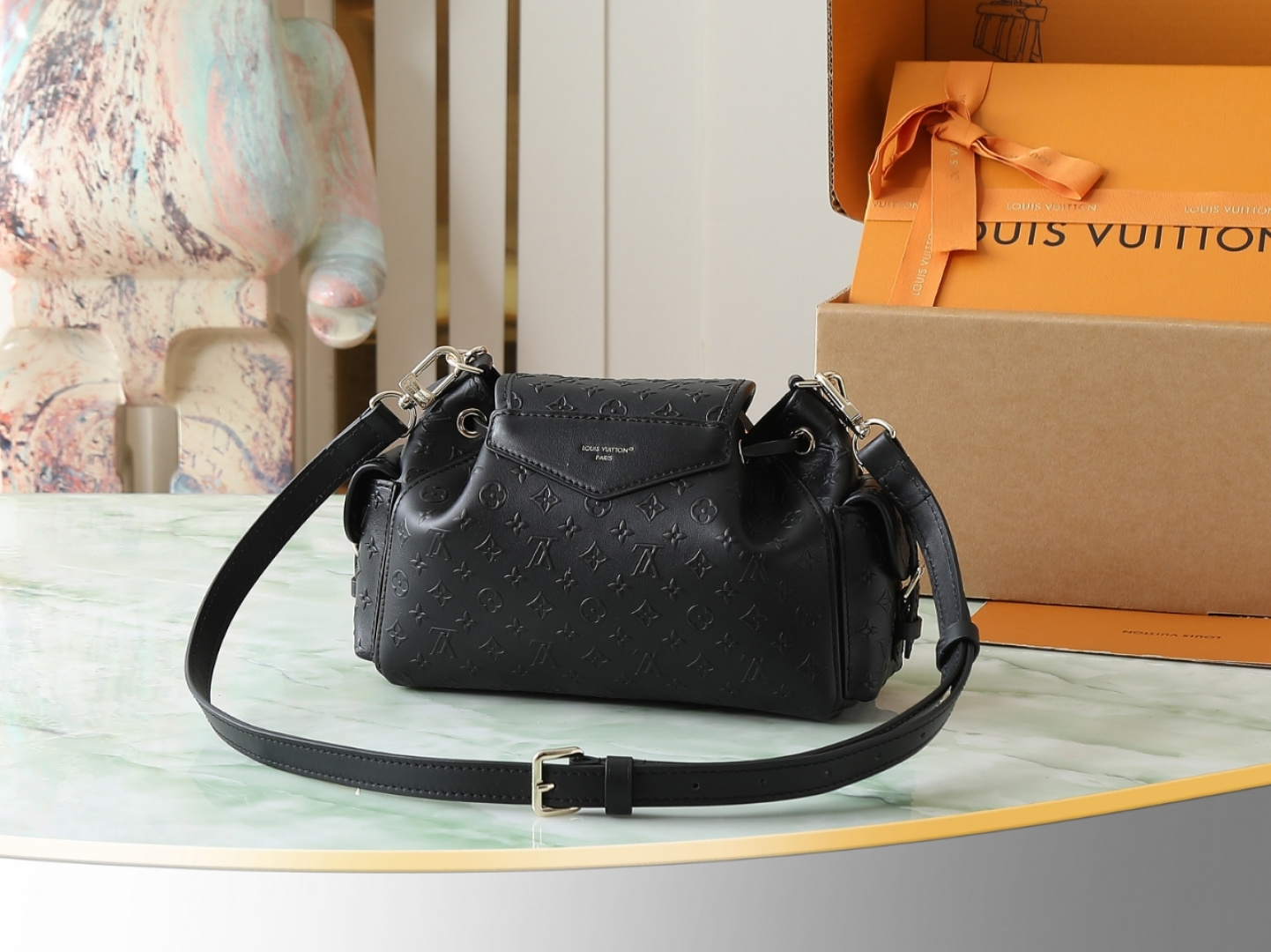 Louis Vuitton The M25554 Odyssée handbag in black full leather, hailing from the Early Autumn 2025 collection, cleverly references the 2024 Cruise collection.