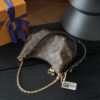 Louis Vuitton Crafted from classic Monogram canvas, this small Boulogne handbag features a double-zip closure and a spacious interior flat pocket large enough to accommodate a smartphone.