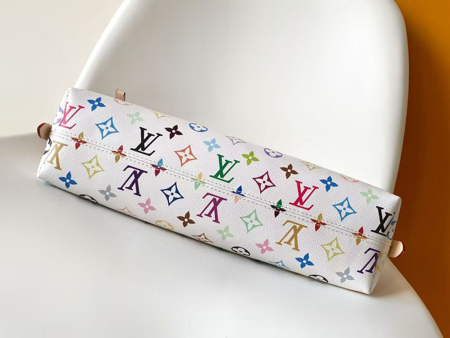 3 Louis Vuitton This Carryall East-West canvas handbag illuminates this classic element with a vibrant splash of color.