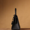 3 Hermes Kelly bag, black, 25cm, with gold hardware.