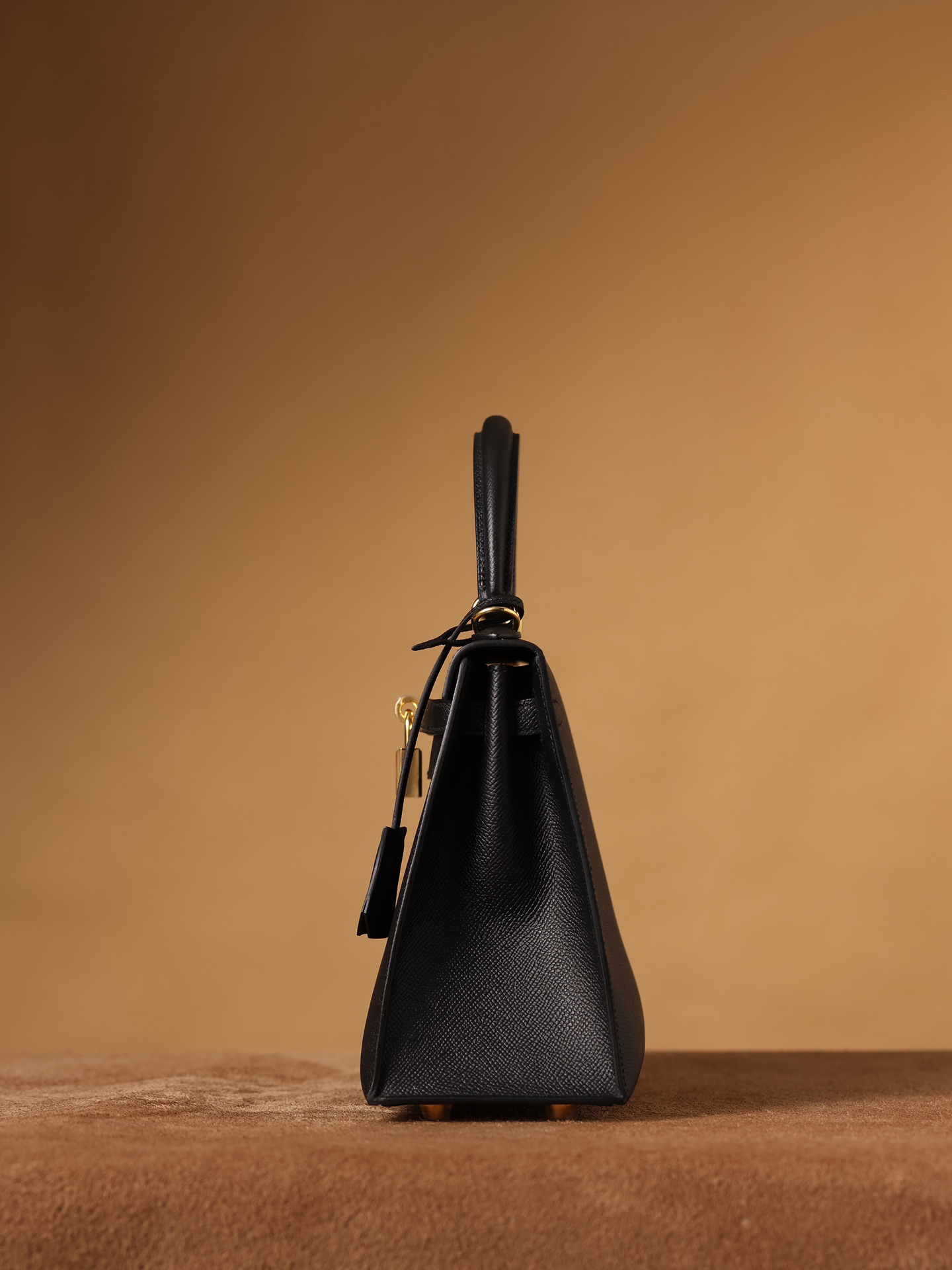 3 Hermes Kelly bag, black, 25cm, with gold hardware.