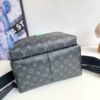 Louis Vuitton This small Discovery backpack features a patchwork of Monogram Eclipse canvas and vibrant cowhide leather.